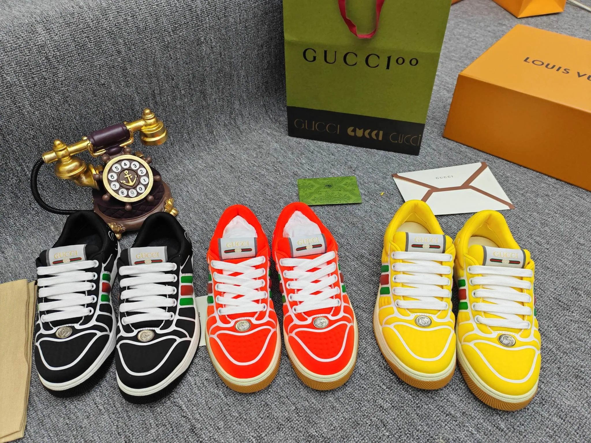 Factory price 600💰Screener series embellished web sneakers. This item is from the Gucci Lido series. Its design is inspired by the summer style and beach clubs of the Italian coast. The Screener series of sneakers draws inspiration from classic sneakers from the 1970s and takes its name from a special defensive move in sports. This shoe from the 2024 Pre-Fall collection is crafted from yellow rubber, a technical and malleable opaque material, with striped webbing on the sides and an embossed Gucci printed logo on the heel. Yellow rubber, opaque and technological in appearance. Red and green webbing decorated with metal Double G oval enamel details. Gucci printed embossed logo. Women 35-40, men 38-45, (men 38 and 45 need to be customized)
